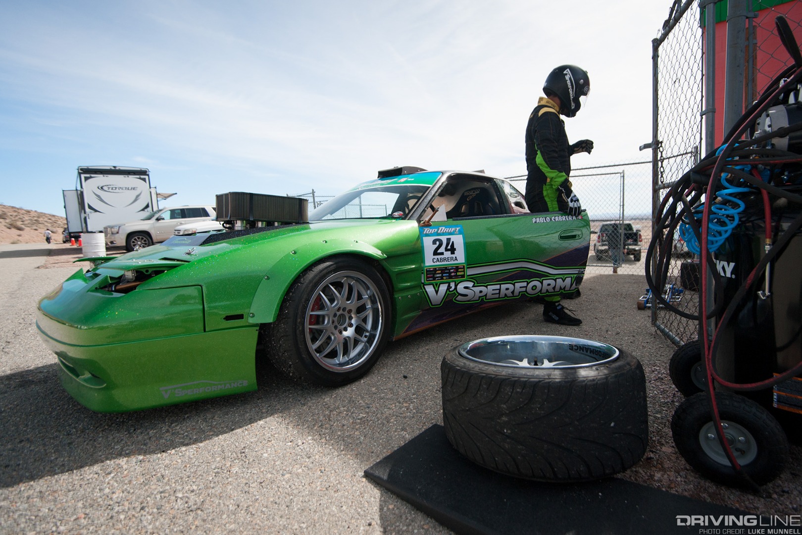 Top Drift round 1 SoCal pro-am drifting Pablo Cabrera green S13 Nissan 240SX fastback in the pits