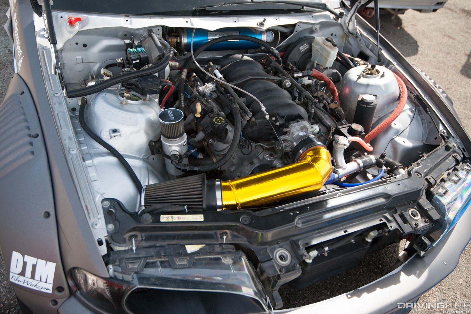 Top Drift round 1 SoCal pro-am drifting Andrew Attalla silver gray E46 BMW M3 GM LS V8 swap engine bay
