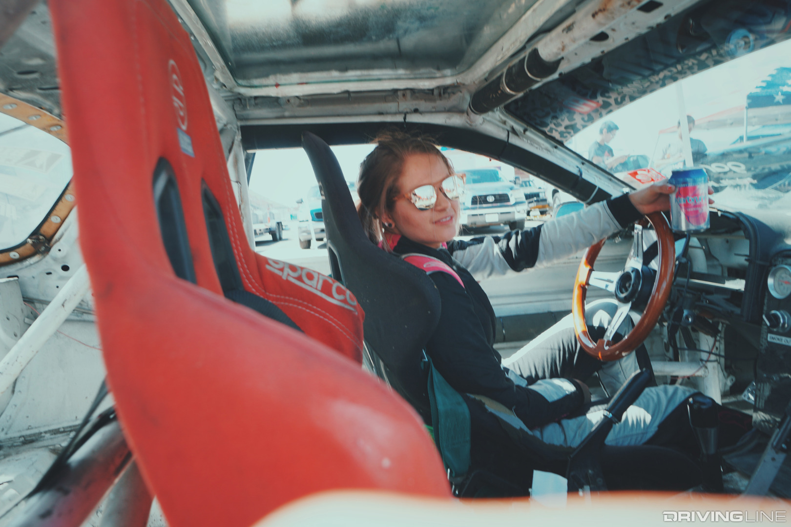Collete Davis in race car wearing sunglasses