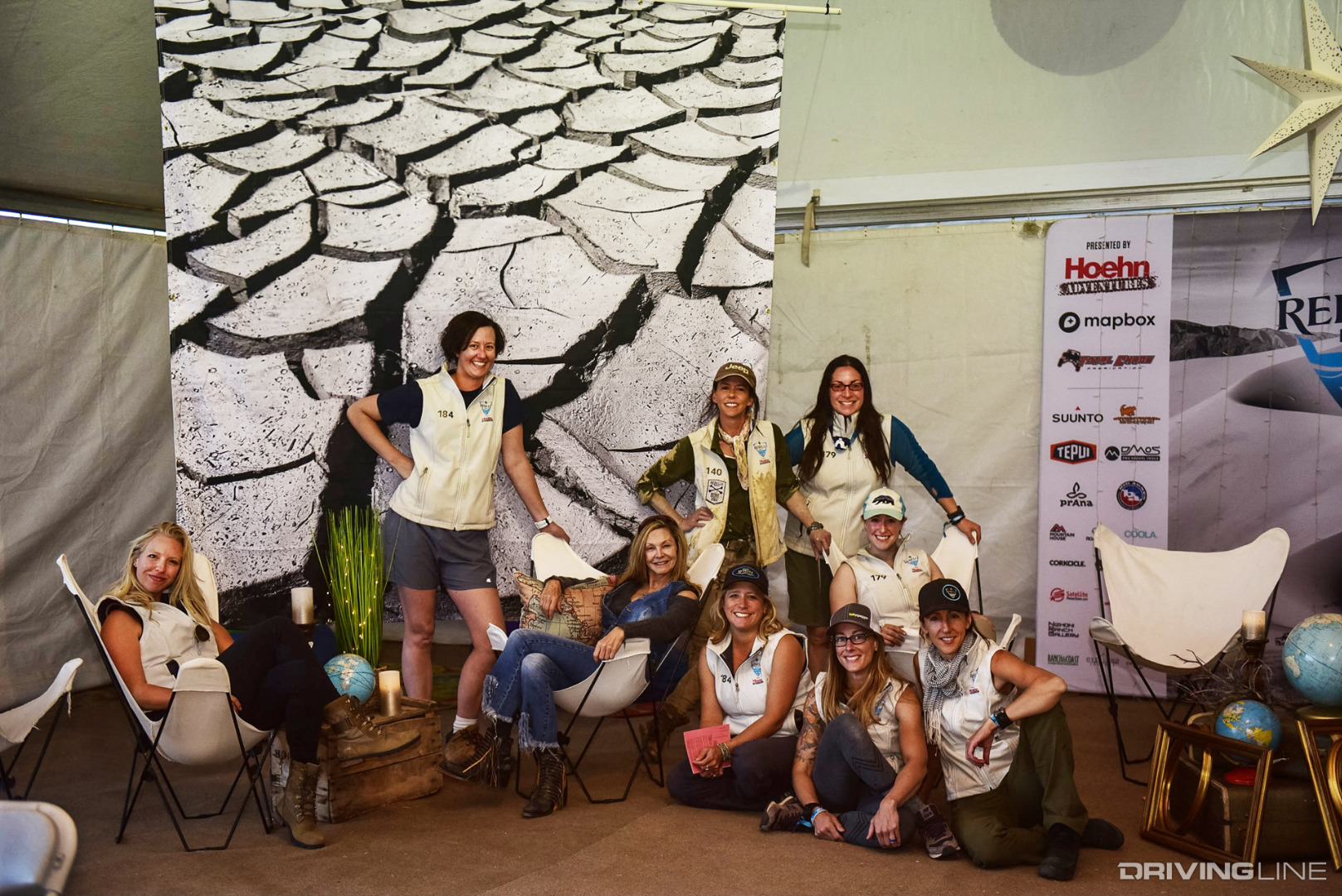 Rebelles having a quick break for a photo in the Rebelle Rally base camp