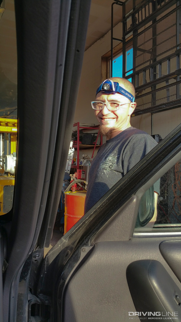 Andy still smiling while working on the Jeep Cherokee