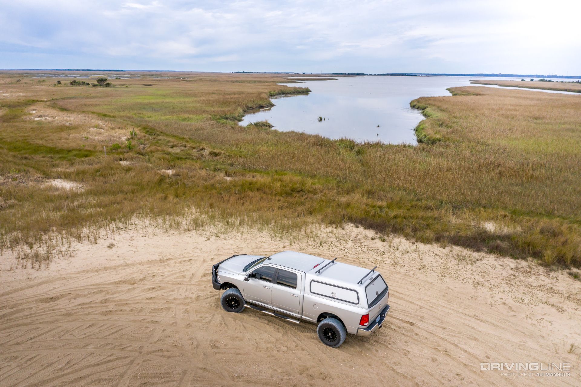 Ram 2500 With ARE CX HD Bed Cap On Sand
