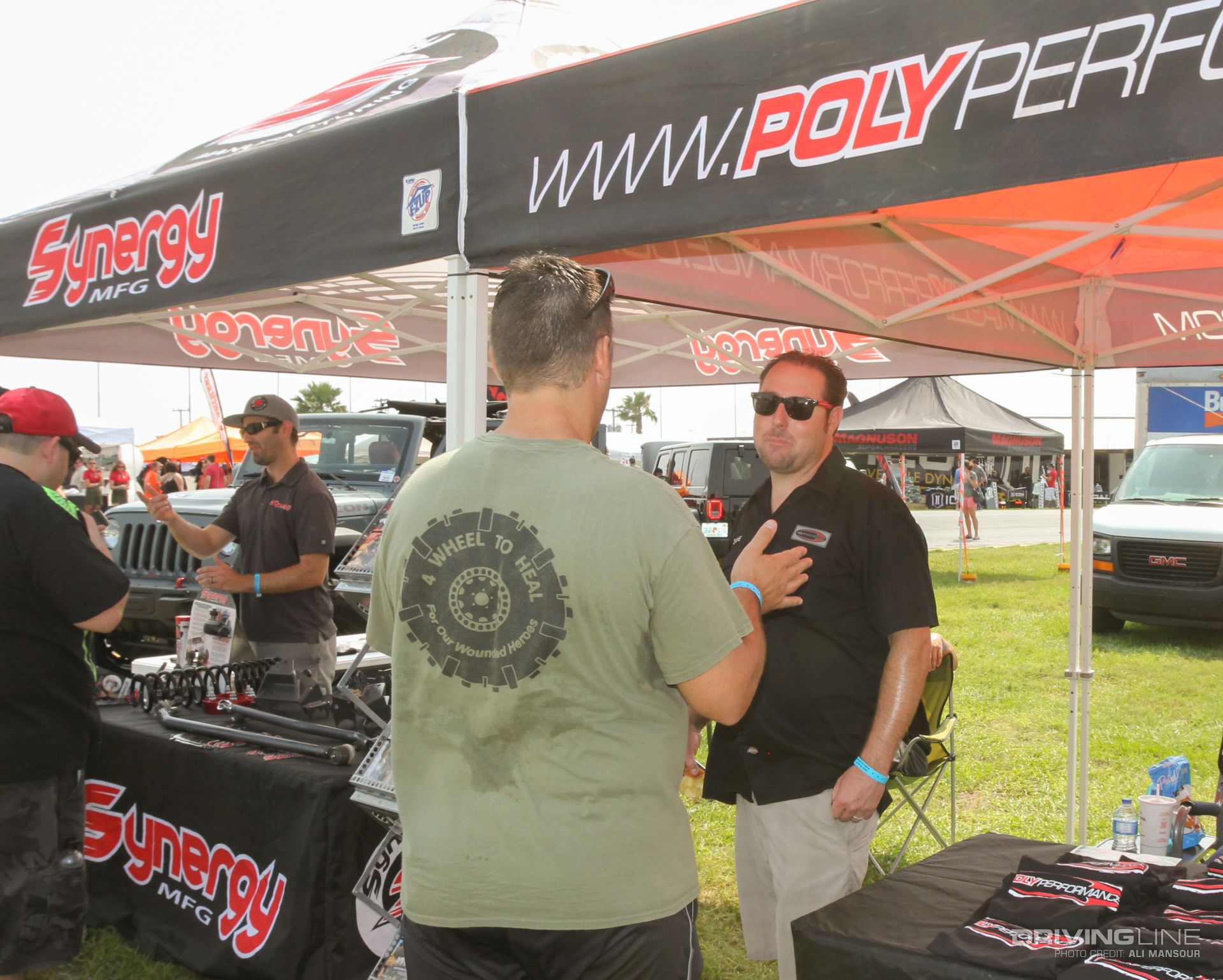 Synergy Mfg representative talking to a fan at Jeep Beach