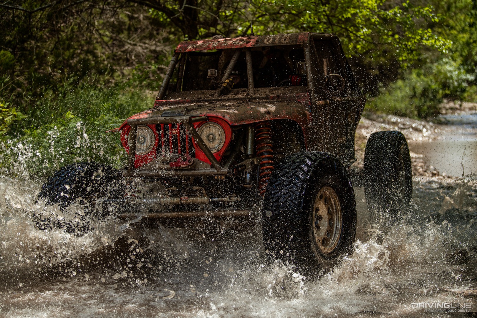 Casey Gilbert racing through a river