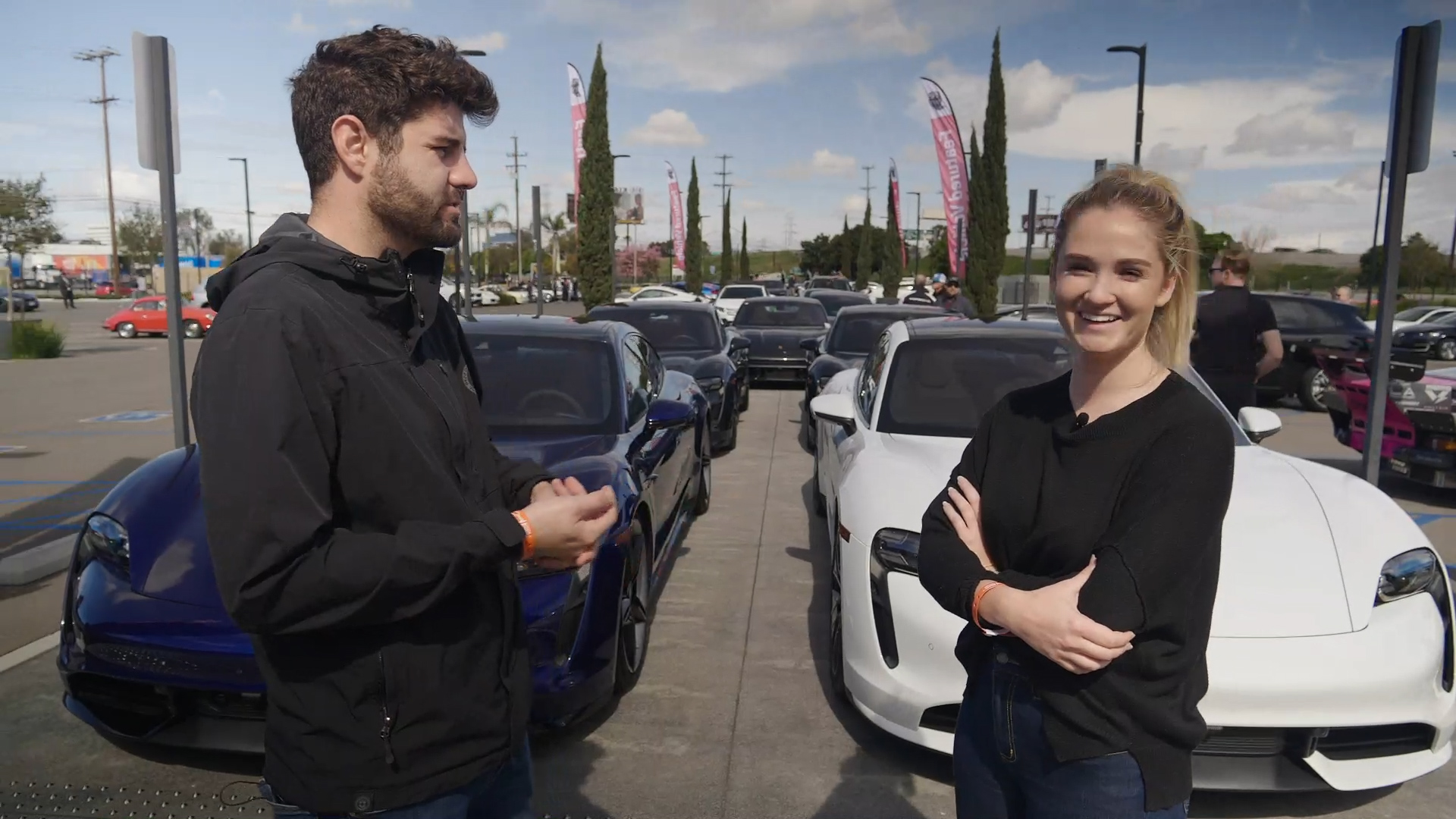 Kelly and Gabe with two Porsche Taycans