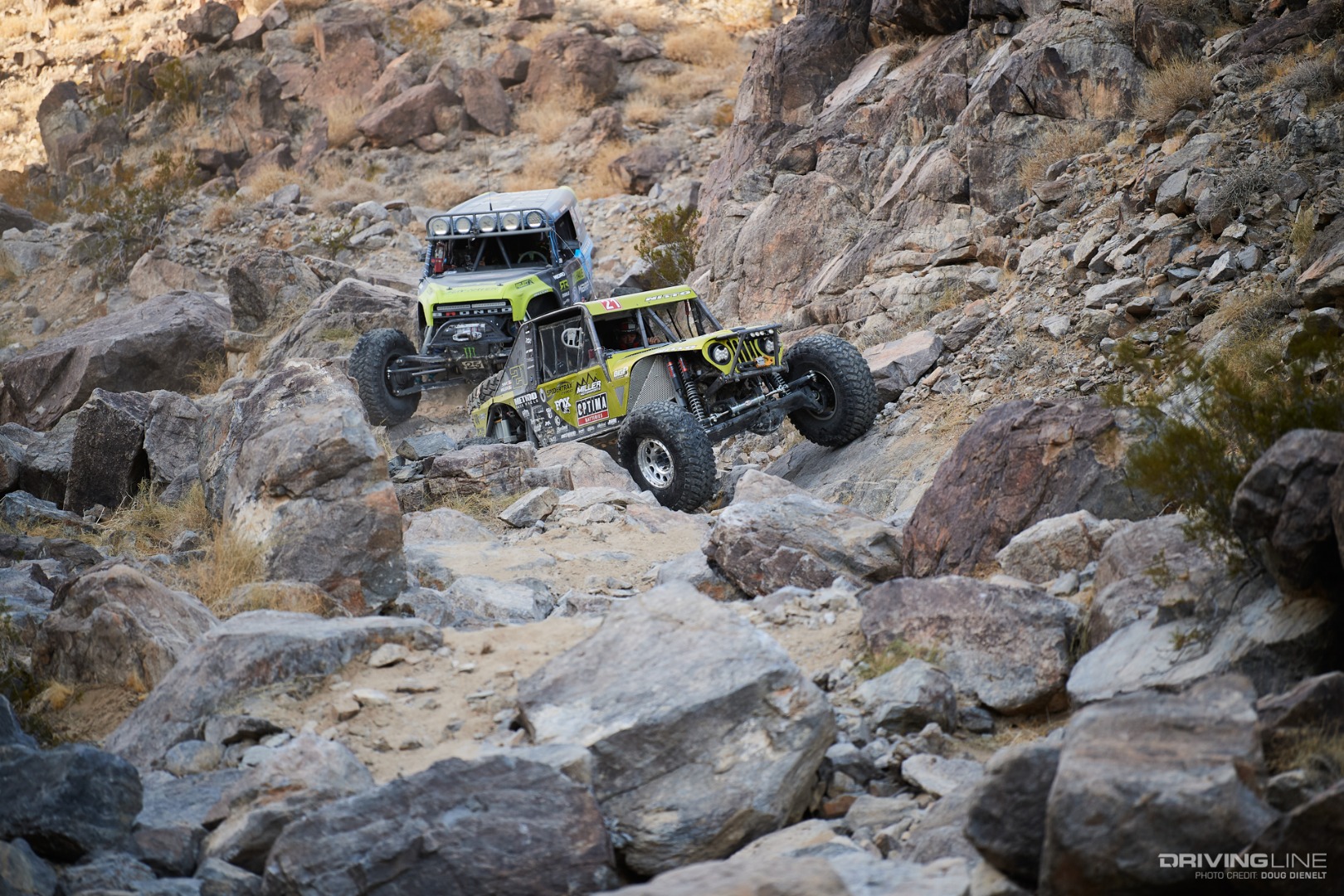 Erik Miller and Vaughn Gittin Jr. driving through the rocks