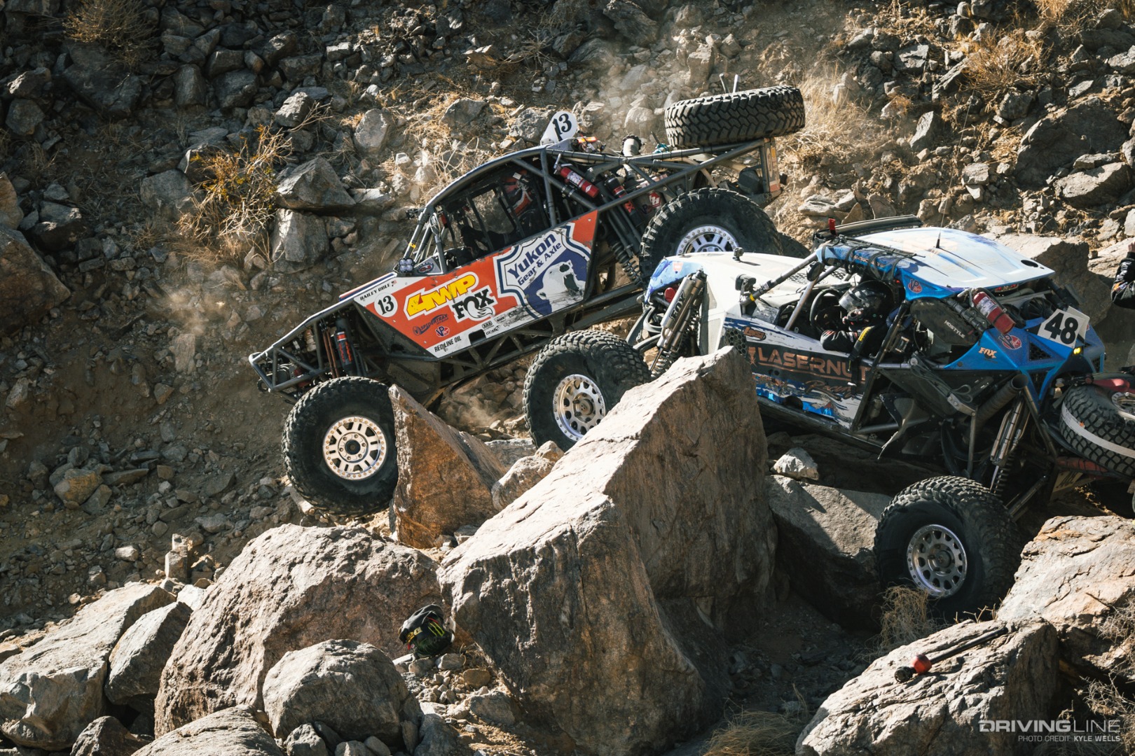 Bailey Cole driving by Cameron Steele's rig through the rocks