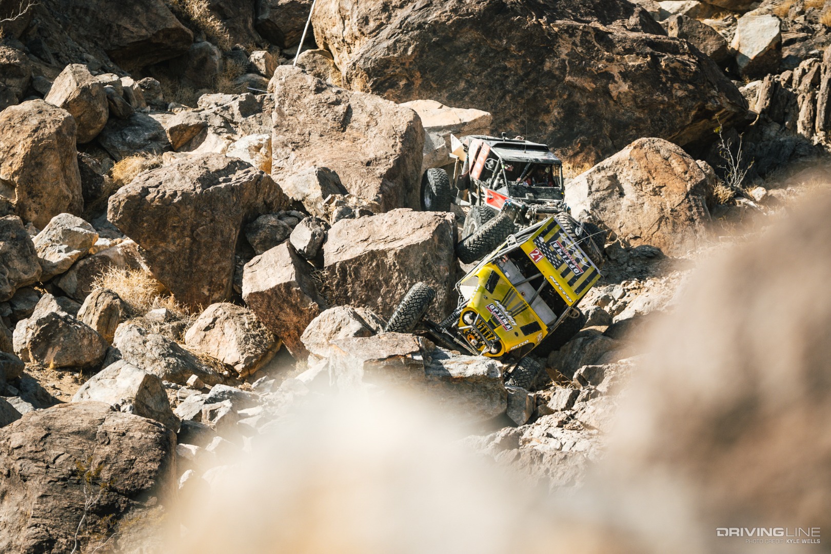 Erik Miller and Levi Shirley driving through the rocks