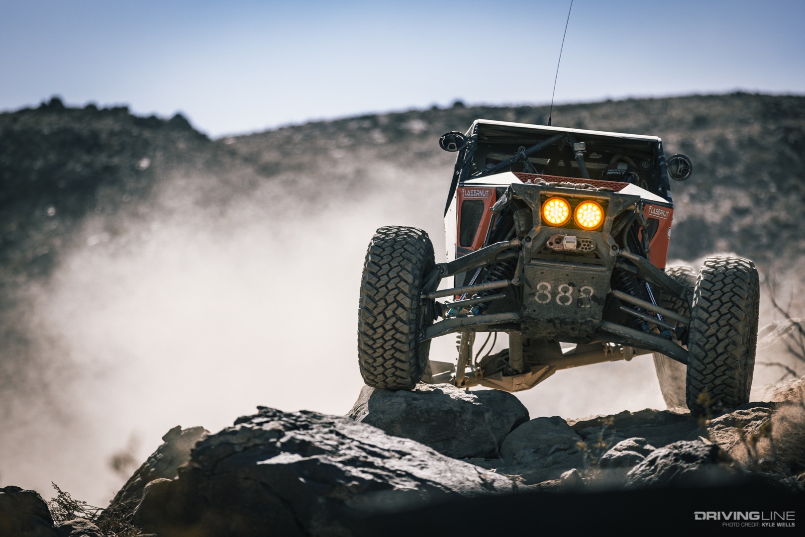 Cody Addington driving over a rock