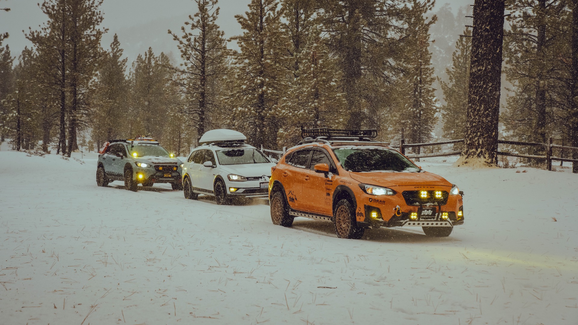 Orange Subaru Crosstrek, White VW Alltrack and Blue Subaru Crosstrek driving through a trail in the new