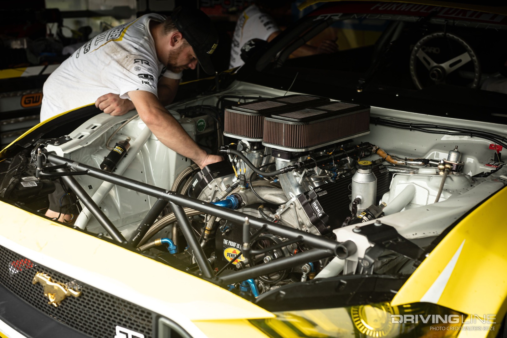 Engine bay and pit crew tuning Chelsea DeNofa's Roush Yates V8 engine