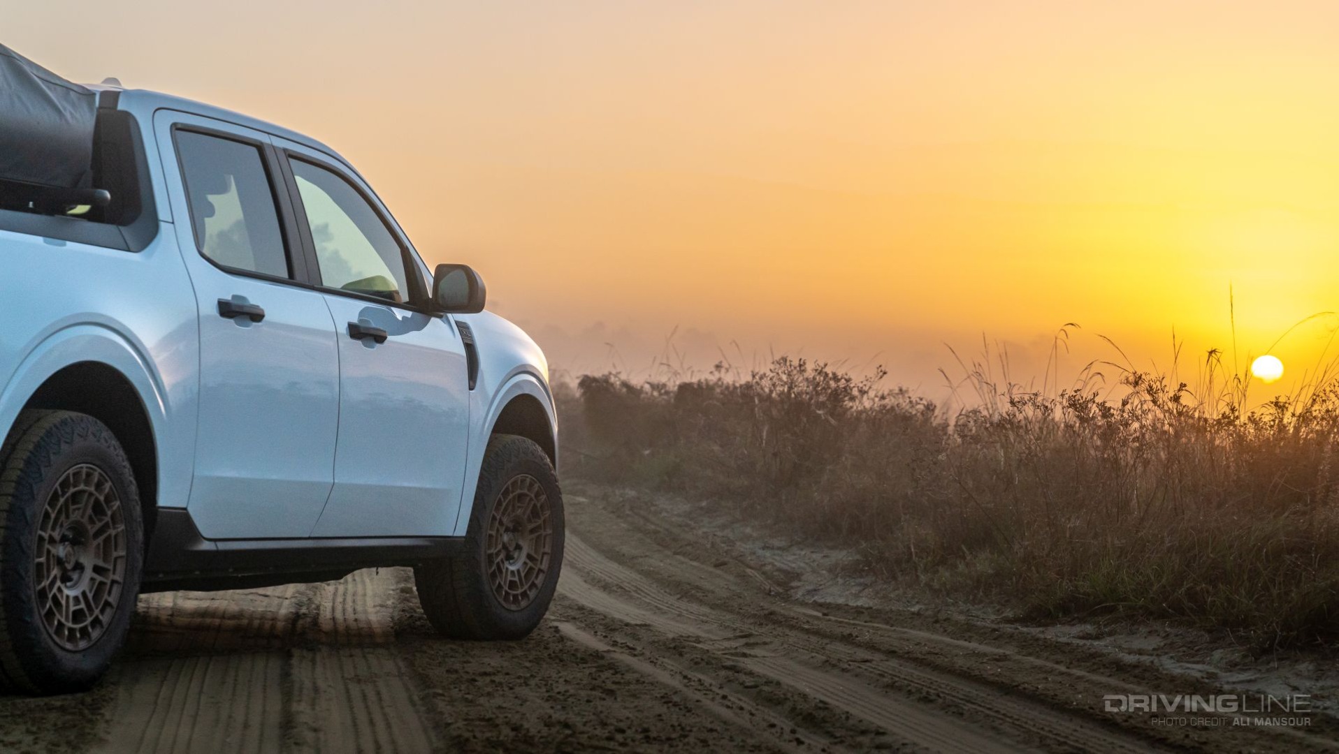 2022 Ford Maverick Hybrid XL Overland on dirt road at sunset