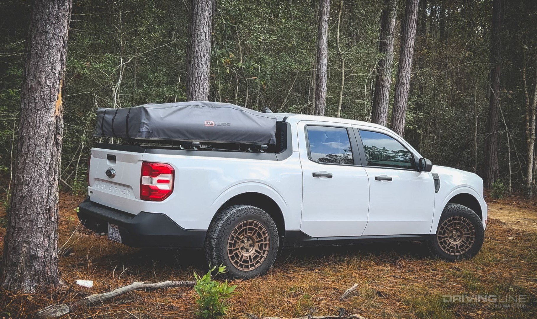 2022 Ford Maverick Hybrid XL Overland on Nomad Grappler tires in woody forest