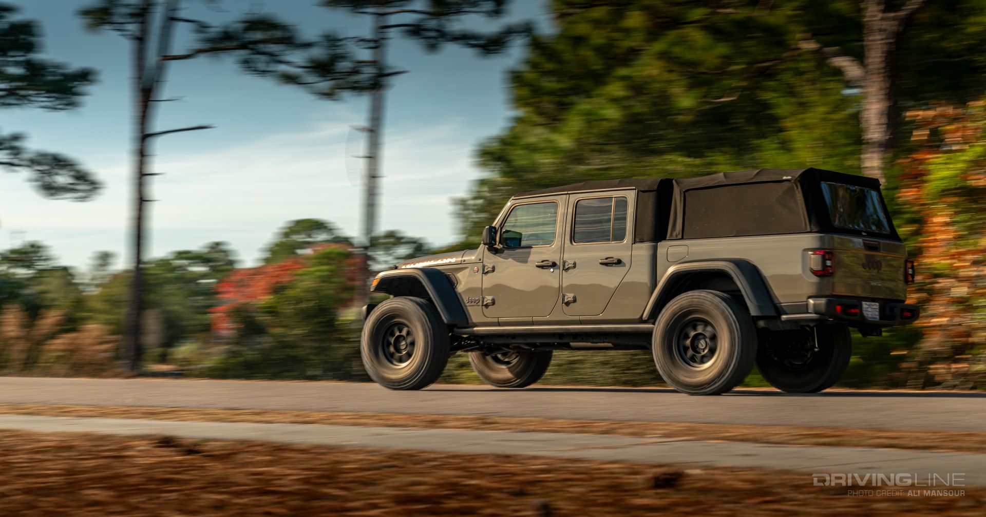 Jeep Gladiator Rubicon Gator Color on 38s side pan blur