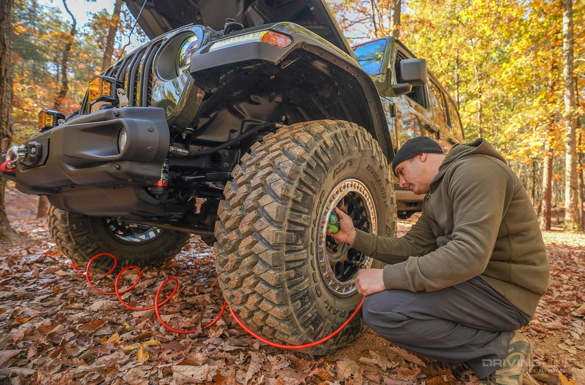 JL on 37s Ali Mansour airing up tire off-road