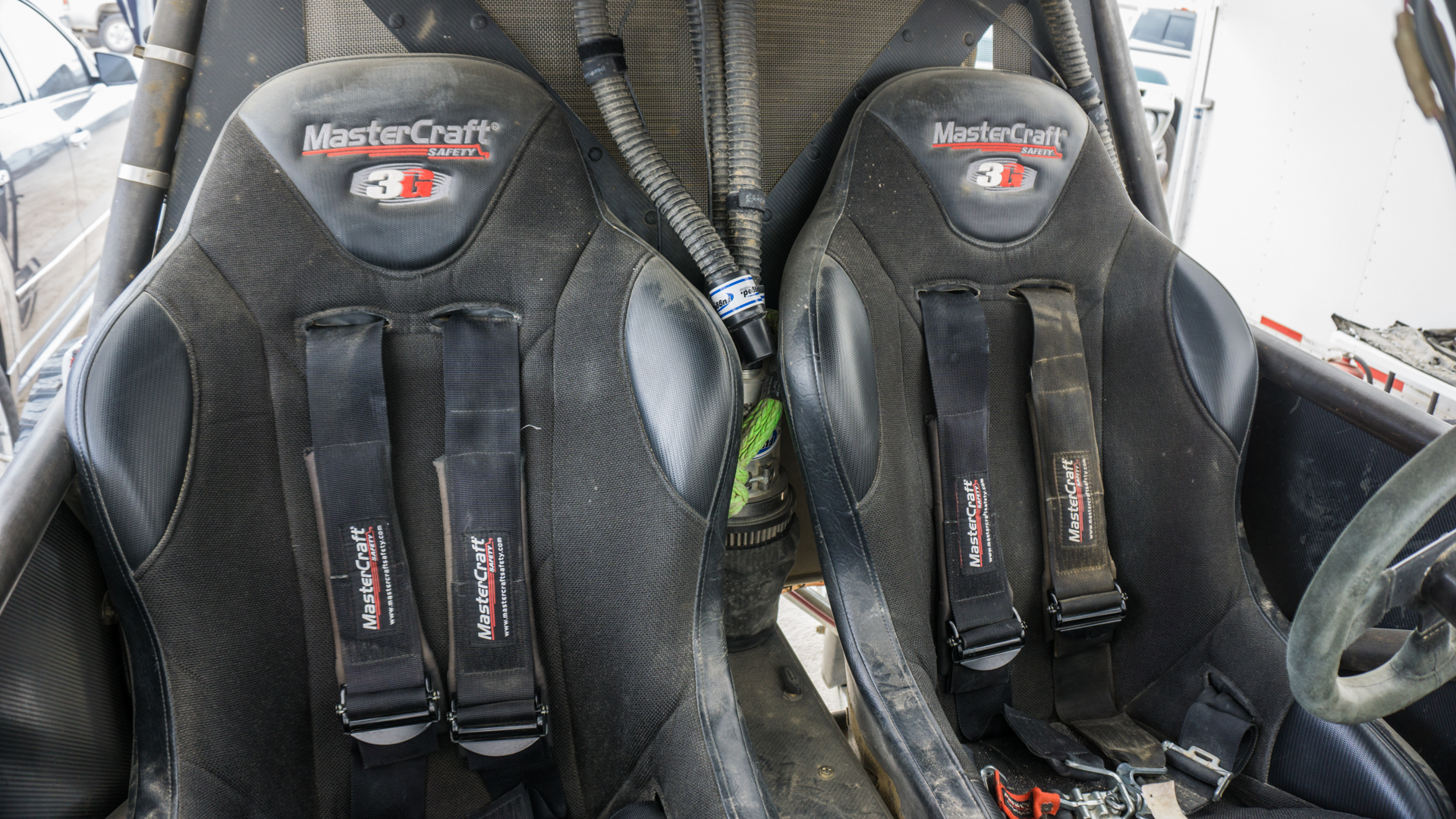 Suspension seats with high bolsters hold the occupants firmly in place and cushion the blow of impacts.