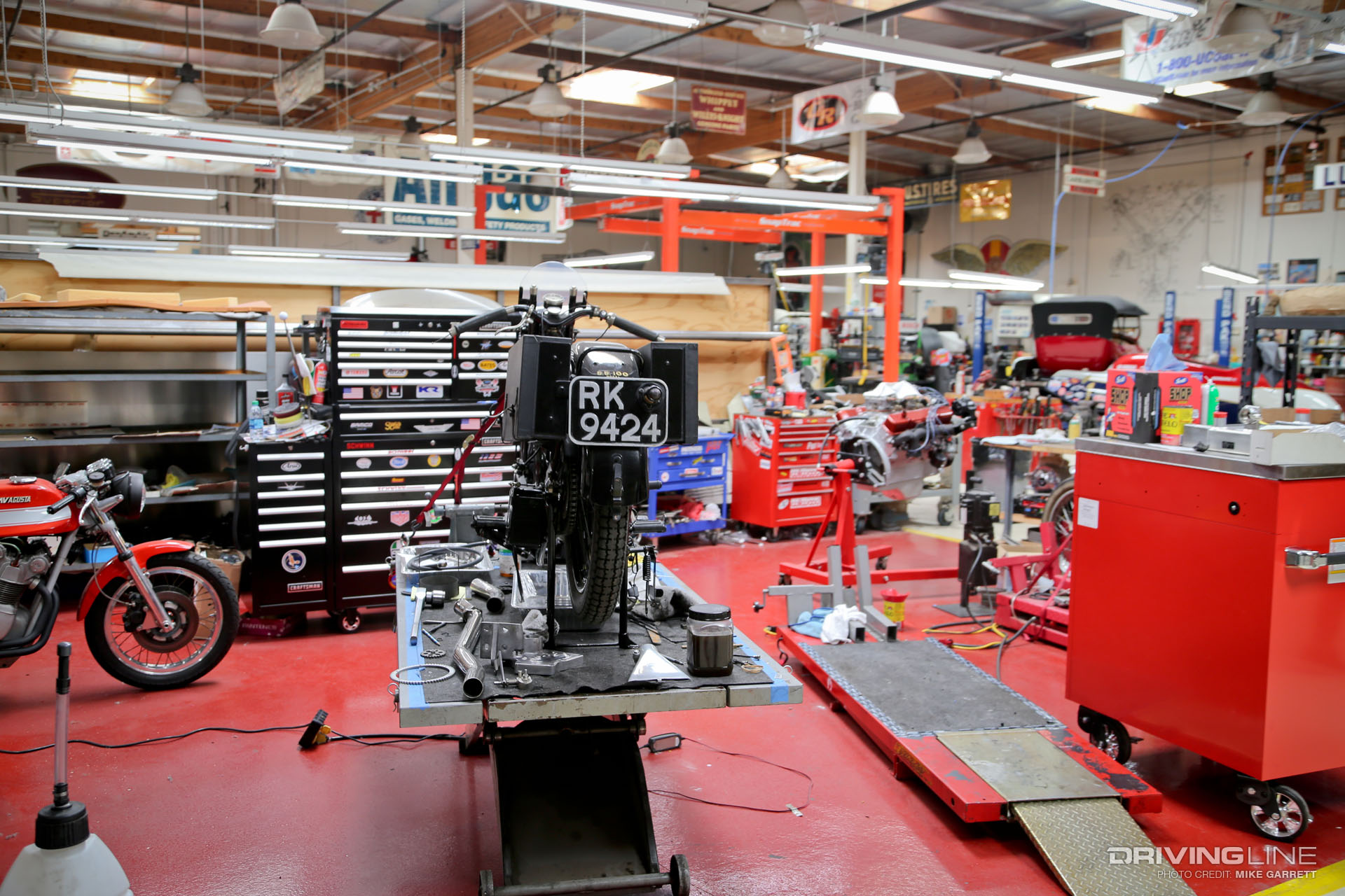 Motorcycle up on a rack and ready to be worked on