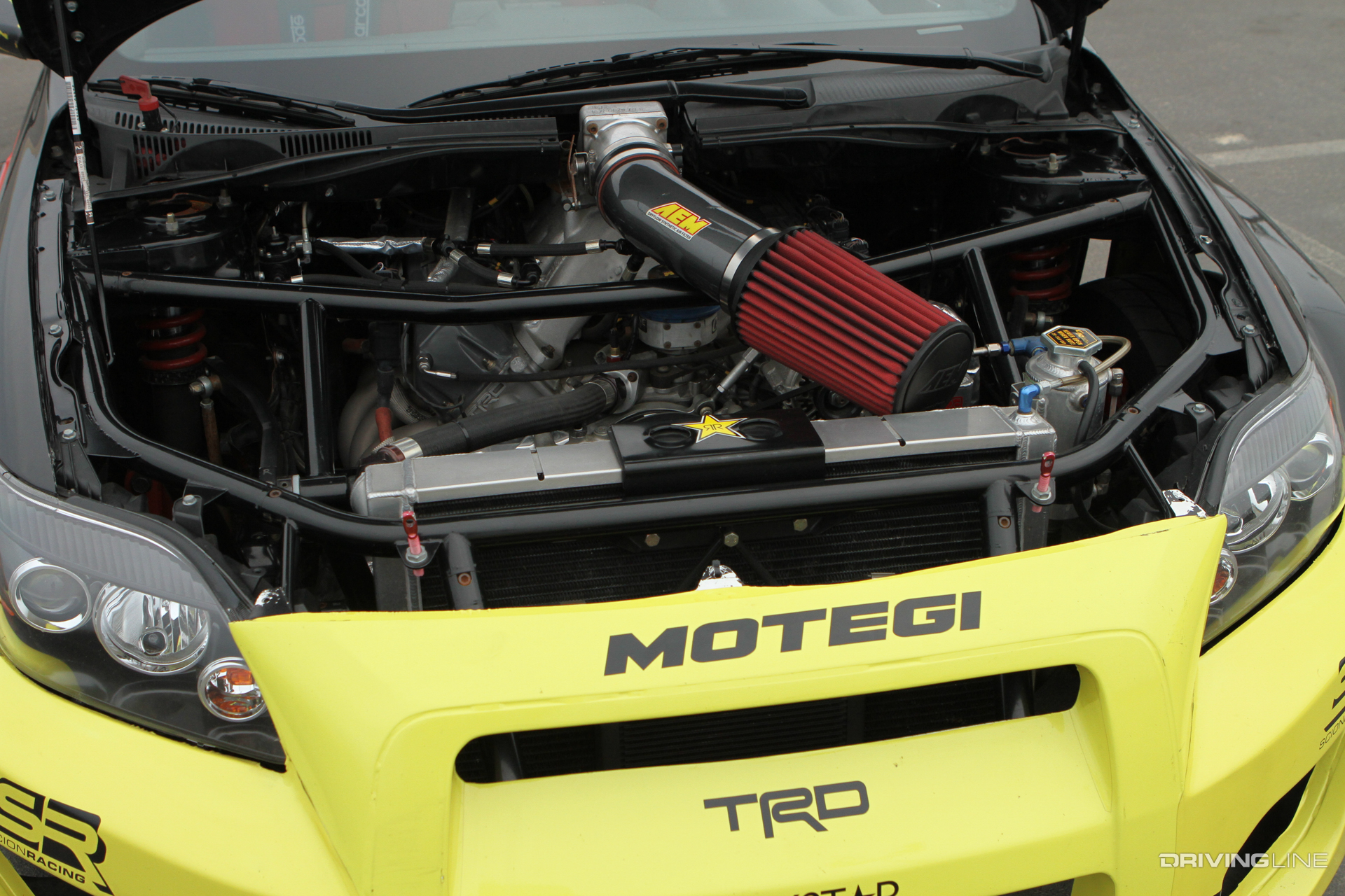 This Papadakis Racing built Scion tC that Tanner Foust drove featured a V8 TRD motor from the NASCAR program at Toyota. This was one of the early examples of a race-spec engine in a drifting chassis