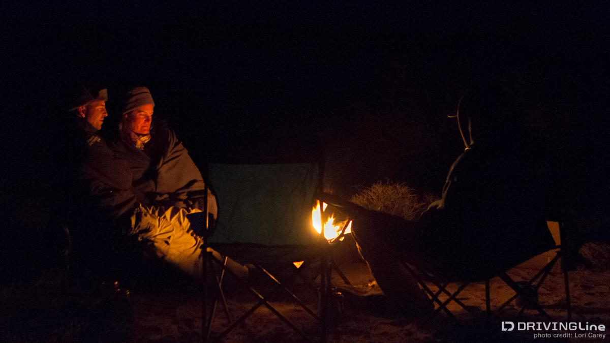 Friends sitting around a campfire