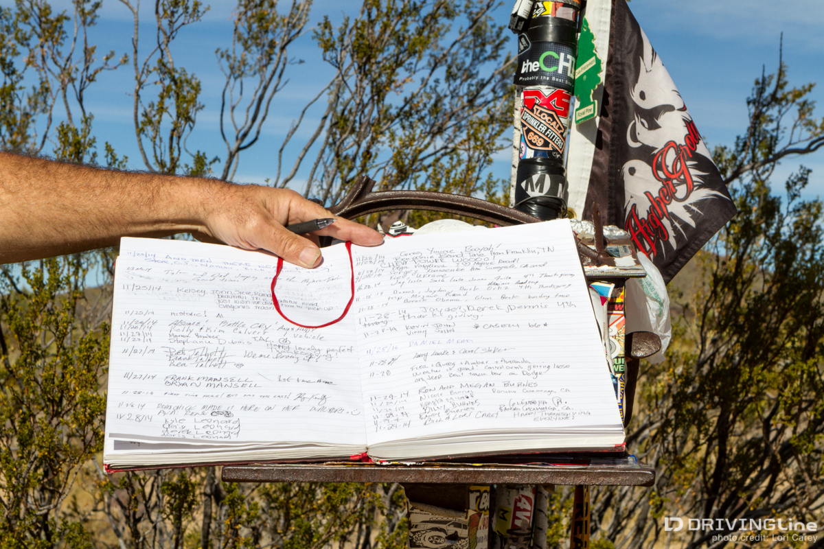Logbook in the Mojave Road Mailbox with signatures and notes from travelers