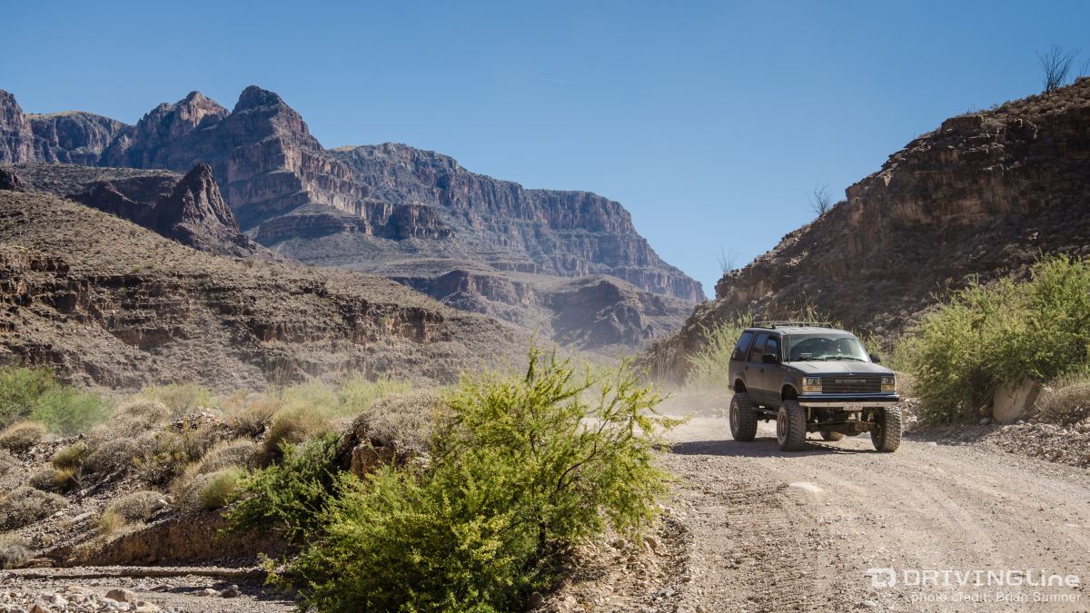 Lifted 4x4 SUV driving on the Grand Canyon trail