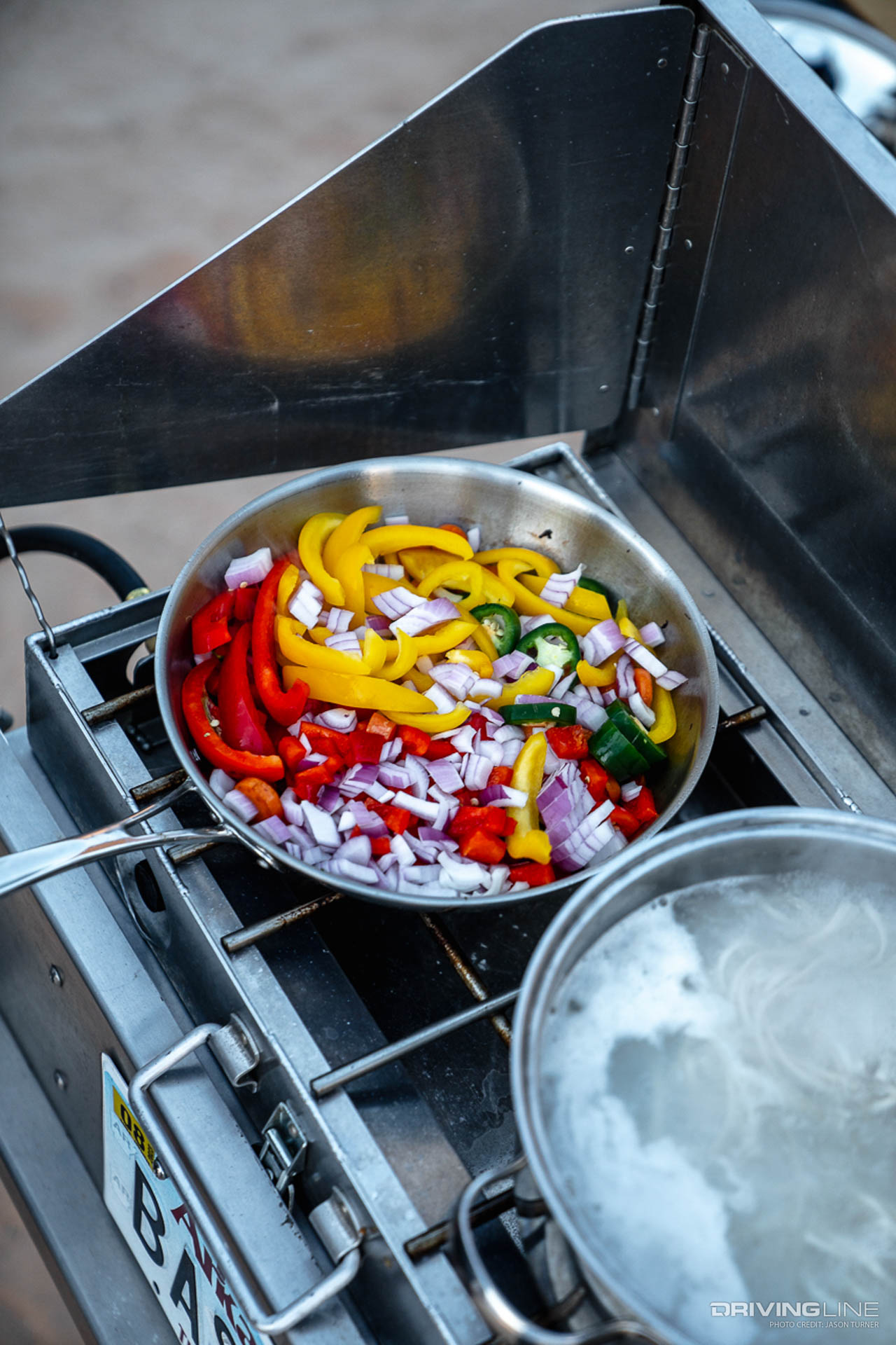 Overlanding Grill with a pan full of mixed vegetables