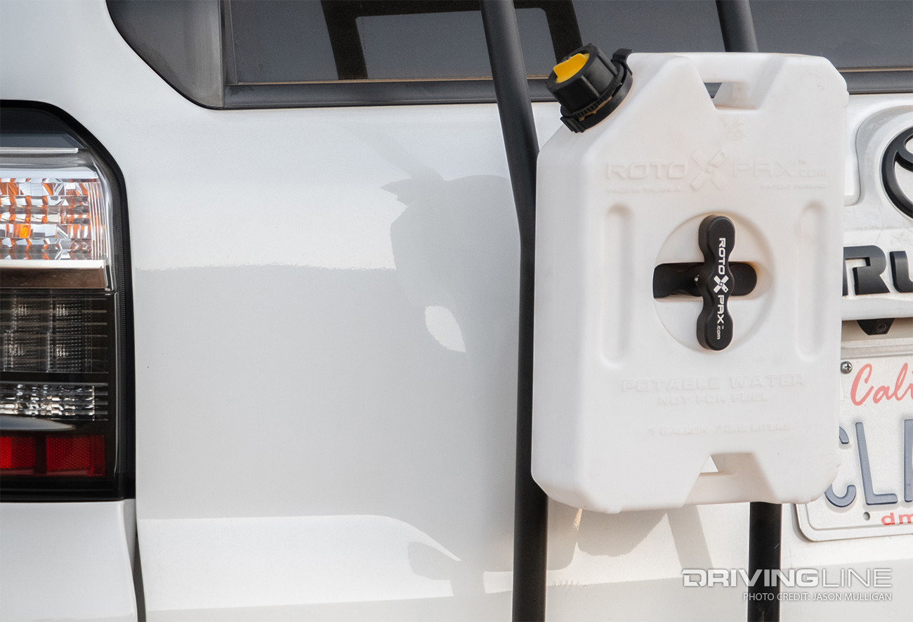 Overland vehicle with jerry can