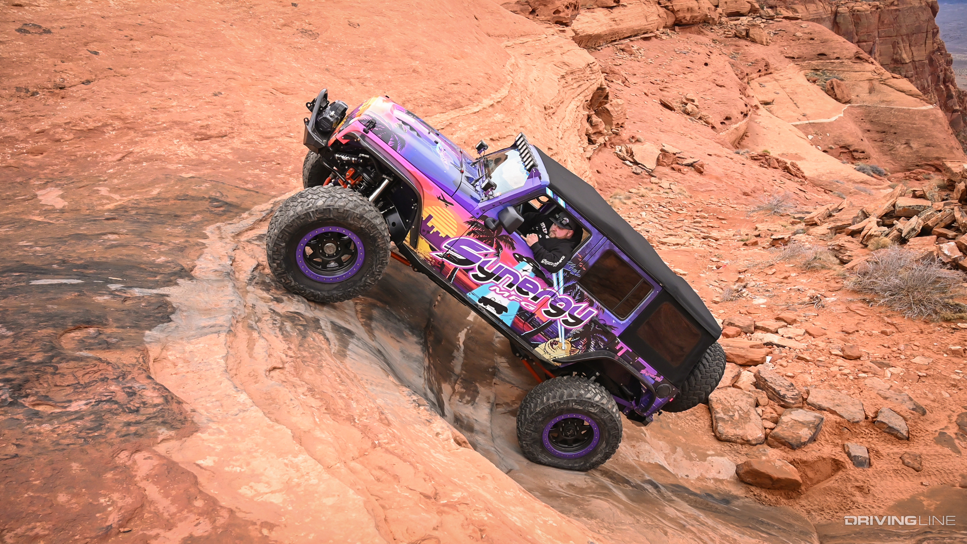 Synergy Jeep JK off-roading on red rocks with Nitto Trail Grappler tires