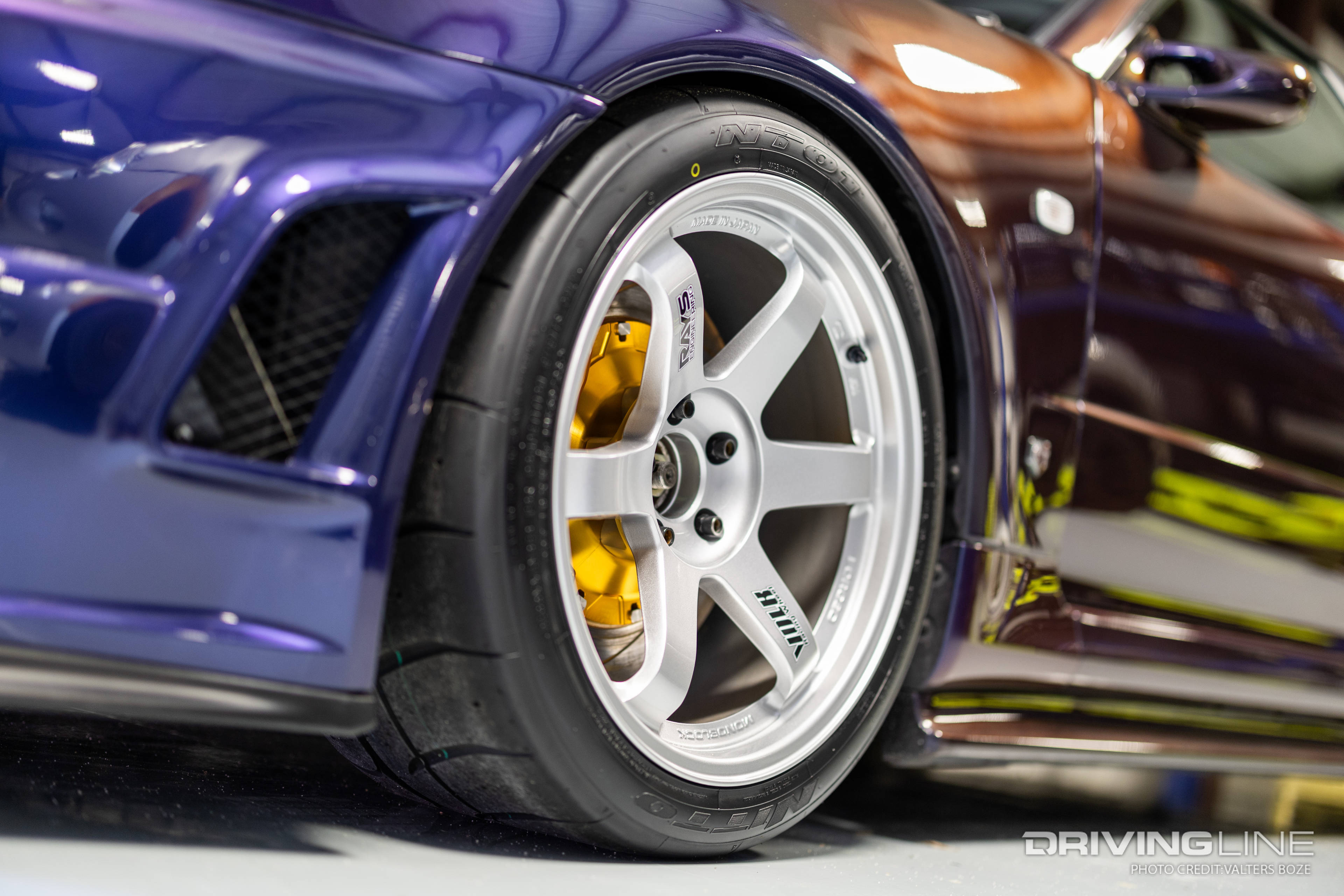 A set of 18" Volk TE37 wheels wrapped in Nitto NT01 275/35/18 tires are planted at each corner of Adam LZ's Nissan R34 Skyline